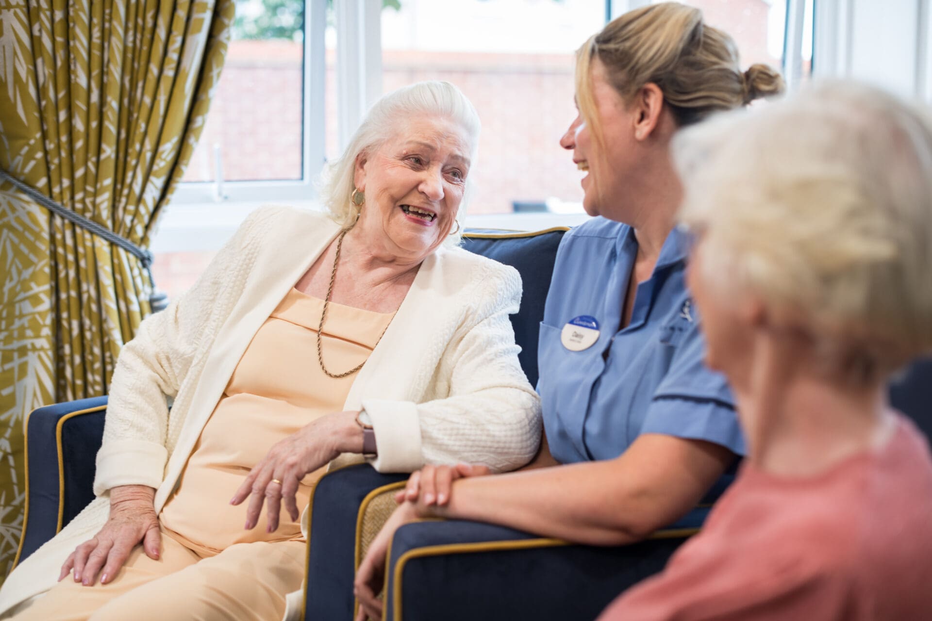 socialising with friends in the lounge at Cinnamon Care Collection