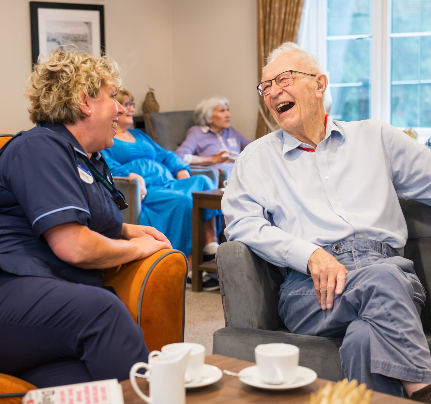 socialising in the lounge at Cinnamon Care Collection