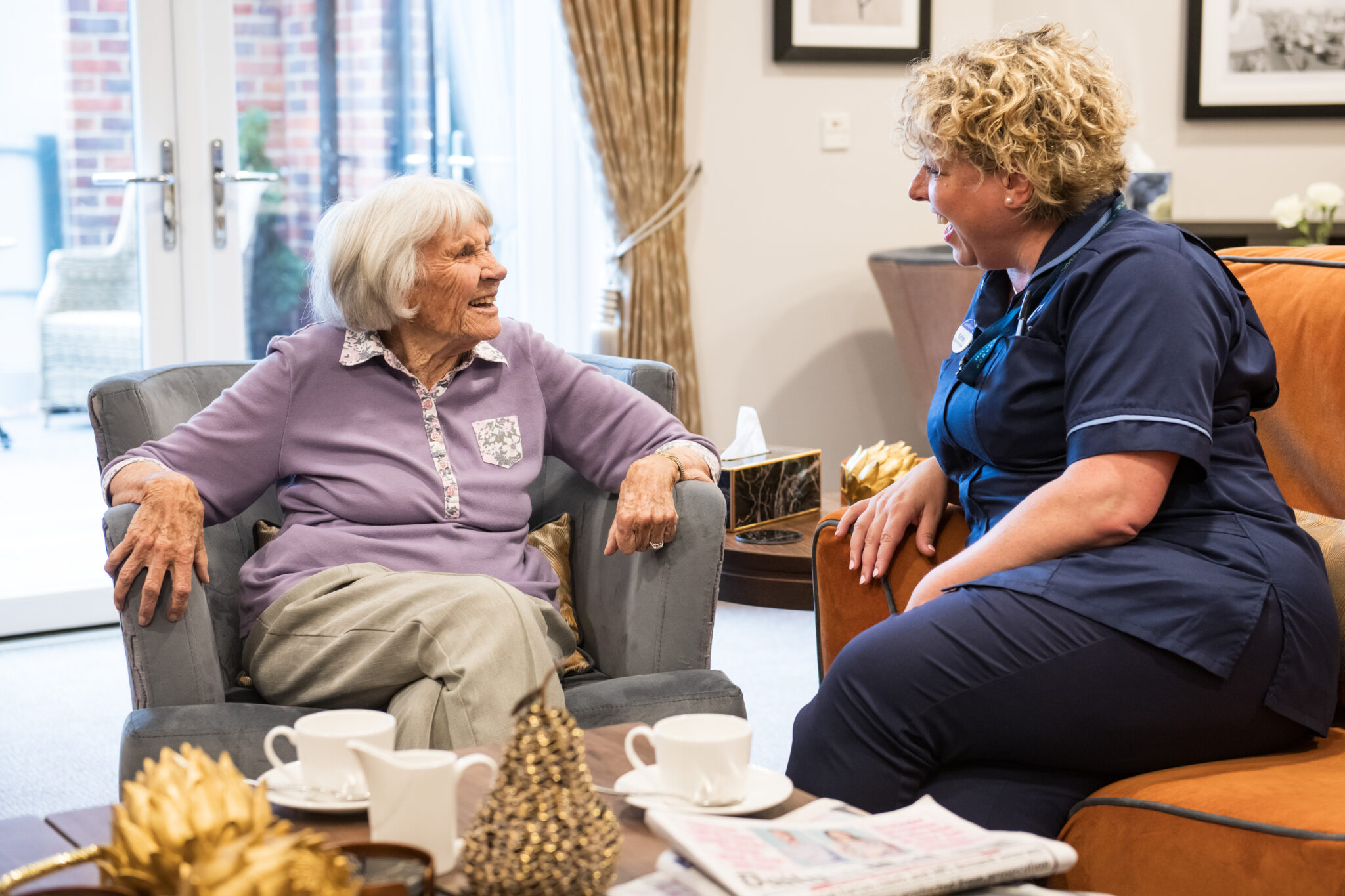 socialising in the lounge at Cinnamon Care Collection 2