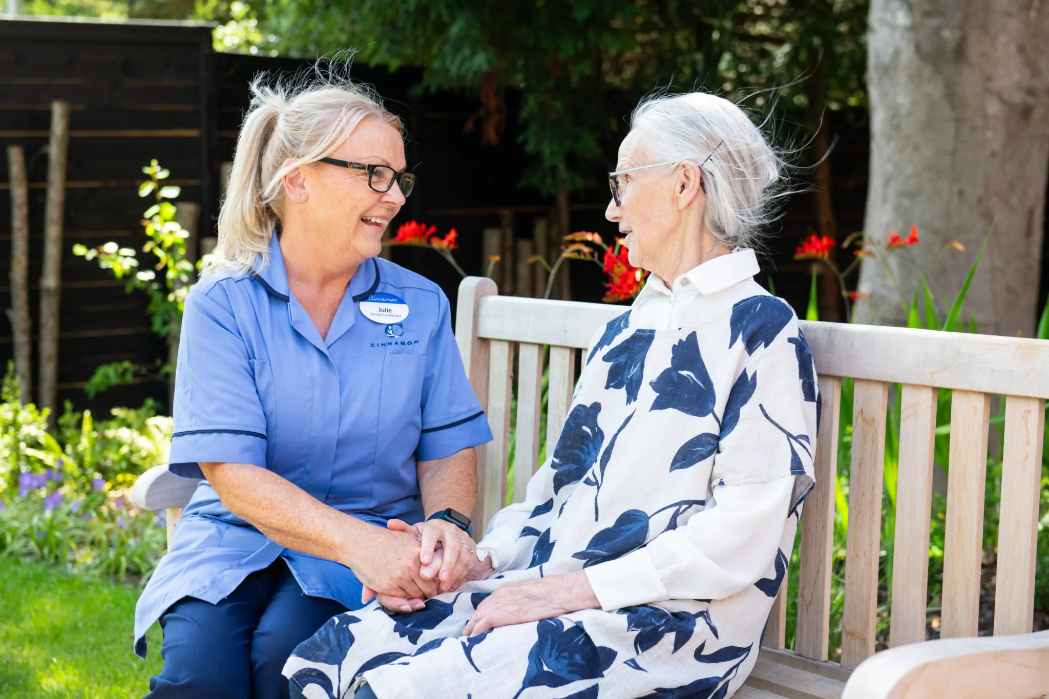 residentis socialising in the picturesque gardens Cinnamon Care Collection 3